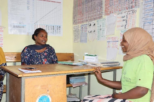 Sitina meeting with a health care worker